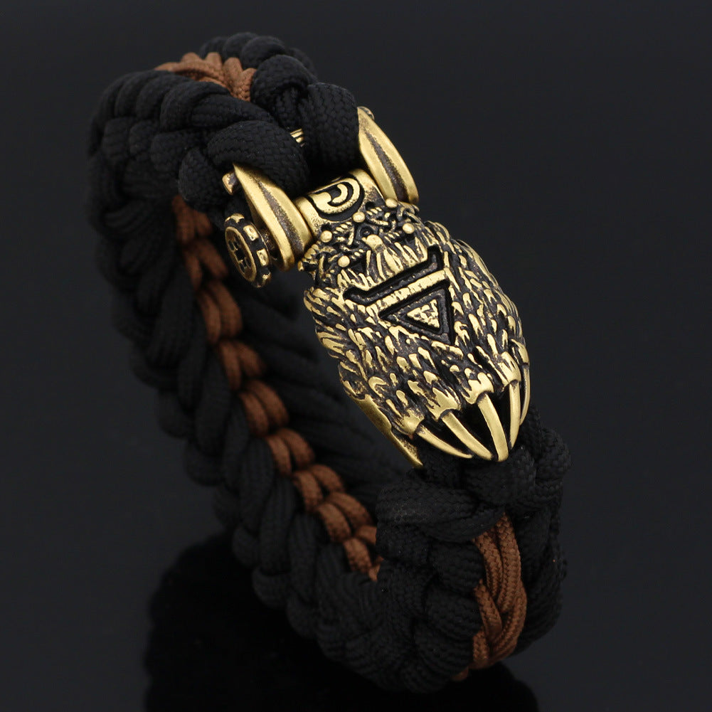 Bracelet with intricate gold design on a black background