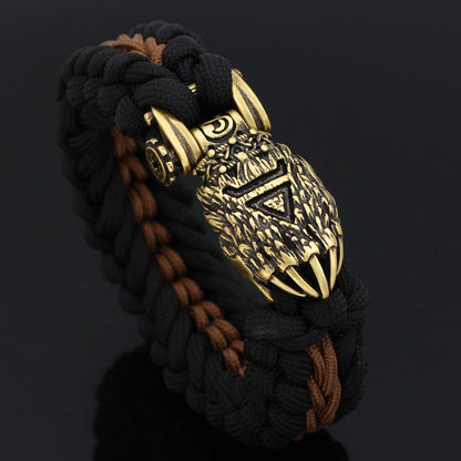 Bracelet with intricate gold design on a black background