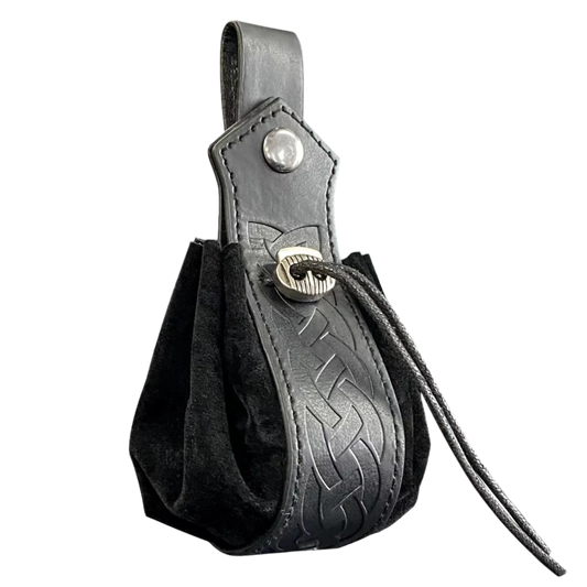 Black leather pouch with embossed design and strap on a white background